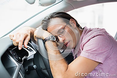 Drunk man slumped on steering wheel Stock Photo