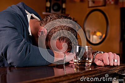 Drunk man who has had one too many at the bar Stock Photo