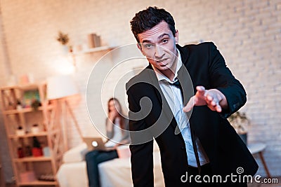 Drunk man with bottle of alcohol came home. Family alcoholic. Alcohol abuse. Stock Photo