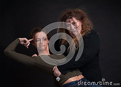 Drunk two women over black background Stock Photo