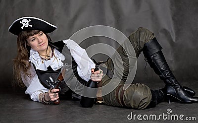 Drunken girl - pirate with pistol and bottle Stock Photo