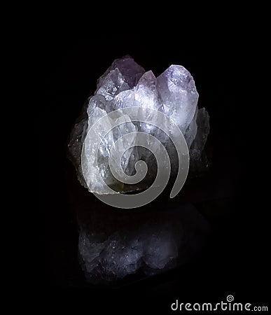 Druse of pink amethyst mineral crystals from Tian Shan mountains. A photo of a stone isolated on black. For geology websites, Editorial Stock Photo