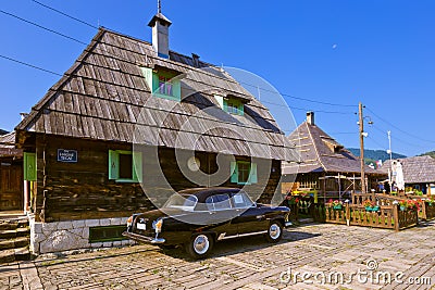 DRVENGRAD, SERBIA - SEPTEMBER 03: Retro cars in traditional village Drvengrad Mecavnik on September 03, 2015 in Drvengrad, Serbia Editorial Stock Photo