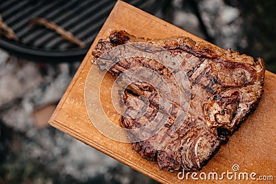 Dry Aged Barbecue Porterhouse Steak T-bone beef steak sliced with large fillet piece with herbs and salt. American meat Stock Photo