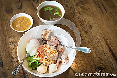 Dry boiled rice with braised pork rip, pork meatball, boiled egg and soup, sauce favorite delicious Asian food Stock Photo