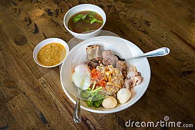 Dry boiled rice with braised pork rip, pork meatball, boiled egg and soup, sauce favorite delicious Asian food Stock Photo