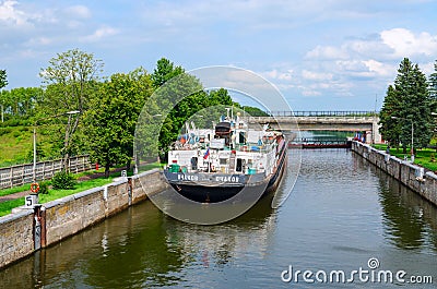 Dry cargo ship Ochakov in ship lock, Uglich, Russia Editorial Stock Photo