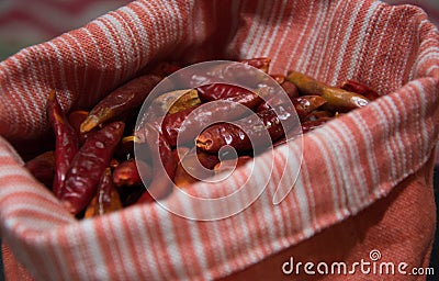 Dry cayenne exposed in very original cloth sack Stock Photo