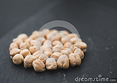 Uncooked chickpeas black board Stock Photo