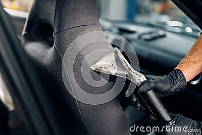 Dry cleaning of car seats with vacuum cleaner Stock Photo