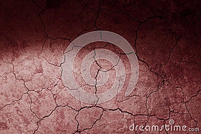 Dry cracked earth red Mars ground texture with spot light. No watering desert. Stock Photo