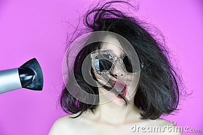 Dry and damaged hair, Hair loss problems cause by heat hair styling tools hair dryer, Funny girl and bad day Stock Photo