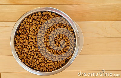 Dry Dog Food in a Stainless Steel Bowl Stock Photo