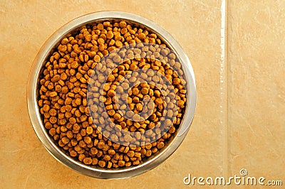 Dry Dog Food in a Stainless Steel Bowl Stock Photo