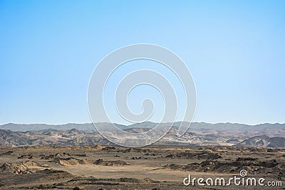 Dry egyptian desert landscape under blue sky Stock Photo