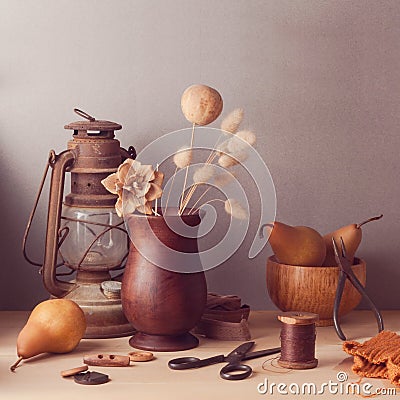 Dry flowers and pears on wooden table. Rustic still life Stock Photo