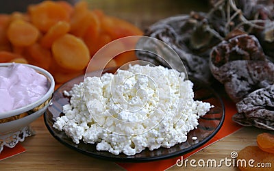 Dry fruit fruits peaches, apricots and hurms with curd and yoghurt Stock Photo