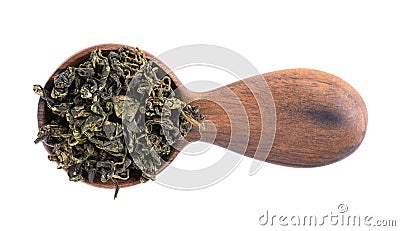 Dry gynostemma pentaphyllum leaf in wooden spoon, isolated on white blackground. Jiaogulan or Miracle grass. Chinese Stock Photo