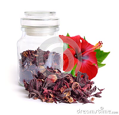 Dry hibiscus tea in glass jar with flower. Isolated on white background. Stock Photo