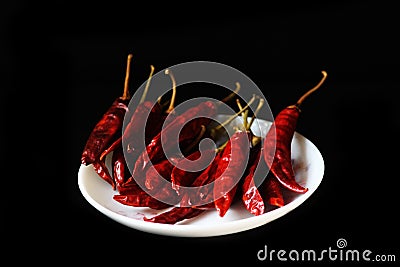 Ground paprika,Powdered red pepper ,dry chili pepper isolated on black background Stock Photo