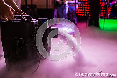 Dry ice low fog machine with hands on for wedding first dance in restaurants Stock Photo