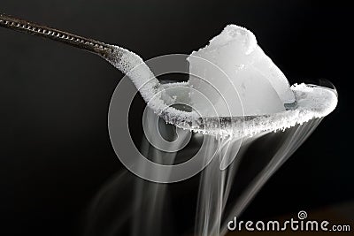 Dry Ice on Metal Spoon Stock Photo