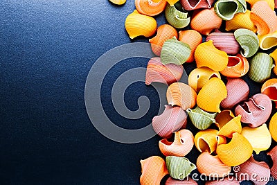 Dry Italian Lumaconi pasta in 5 colours Stock Photo