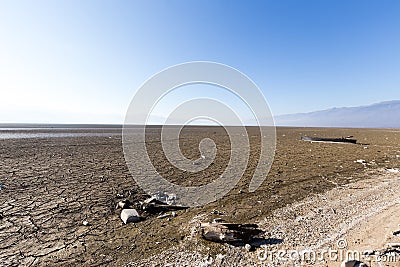 Dry lake bed with natural texture of cracked clay in perspective Stock Photo