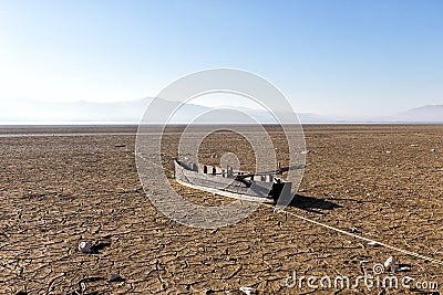 Dry lake bed with natural texture of cracked clay in perspective Stock Photo