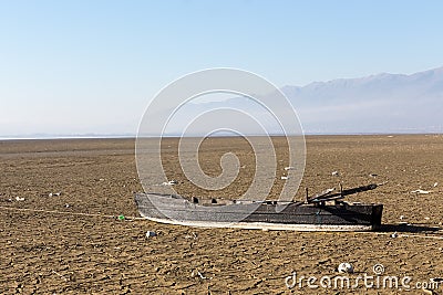 Dry lake bed with natural texture of cracked clay in perspective Stock Photo