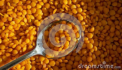 Dry lentils spoon on wooden background Stock Photo