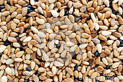 Dry organic brown sesame seed background Stock Photo