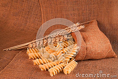 Dry pasta closeup uncooked on background Stock Photo