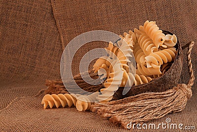 Dry pasta closeup uncooked on background Stock Photo