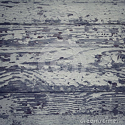 Dry peeling paind on the wooden surface. Toned. Stock Photo