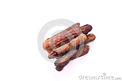 Dry pickled tamarind taste sweet and sour Thai preserved food on white background Stock Photo