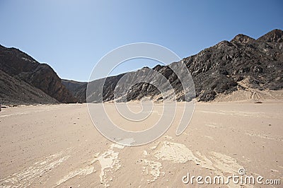 Dry river valley in desert mountains Stock Photo