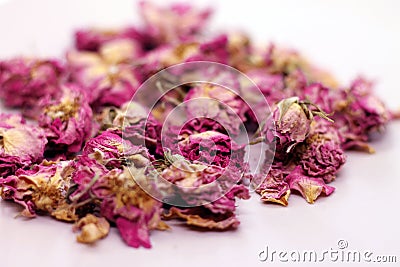 Dry rose buds for tea on white background. Stock Photo