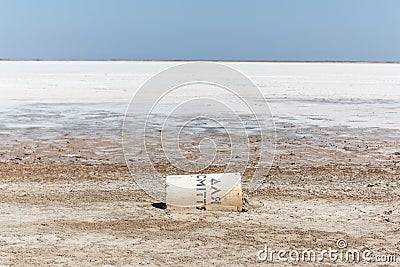 Dry salt lake with a fallen container Stock Photo