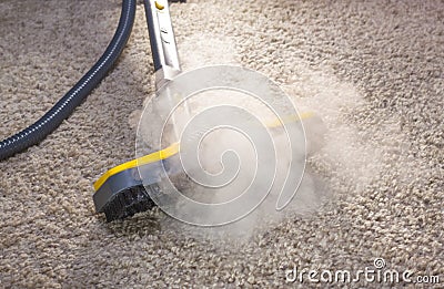 Dry steam cleaner in action. Stock Photo