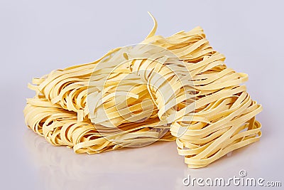 Dry thick rolled noodles square shape. Capelli d`angelo, Angel`s hair - pasta. Stock Photo
