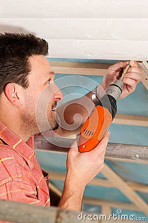 Dry waller with cordless screwdriver Stock Photo