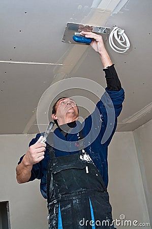 Dry waller making ceiling Stock Photo