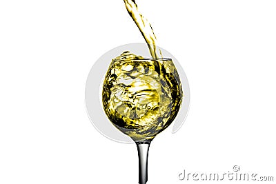 Dry white wine is poured into a glass Stock Photo