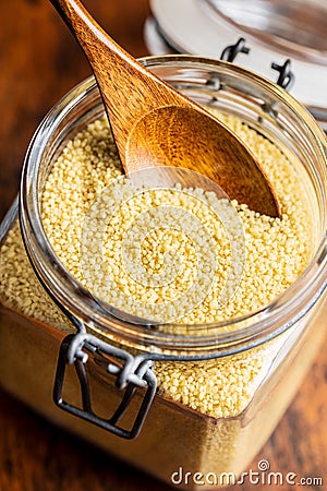 Dry yellow couscous Stock Photo