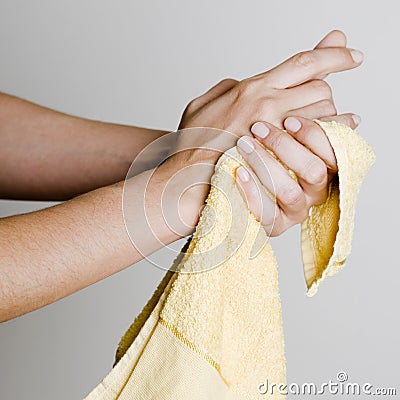 Drying hands with a towel Stock Photo