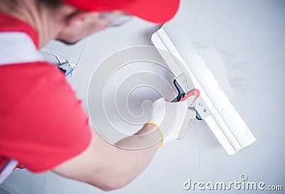 Drywall Patch by Worker Stock Photo