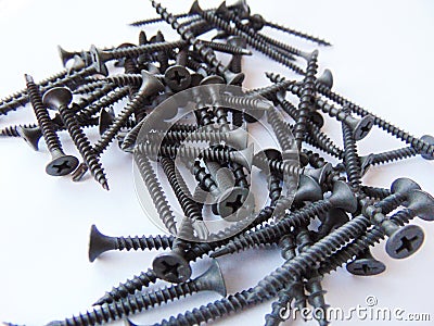 Black screws for drywall such as fixing systems Stock Photo