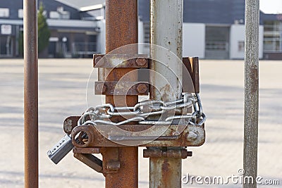 Locked metal fence with chain and padlock Stock Photo