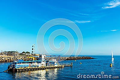 DSC dredge Twin Lakes is dredging sand and silt in harbor channel of Santa Cruz Small Craft Harbor Editorial Stock Photo